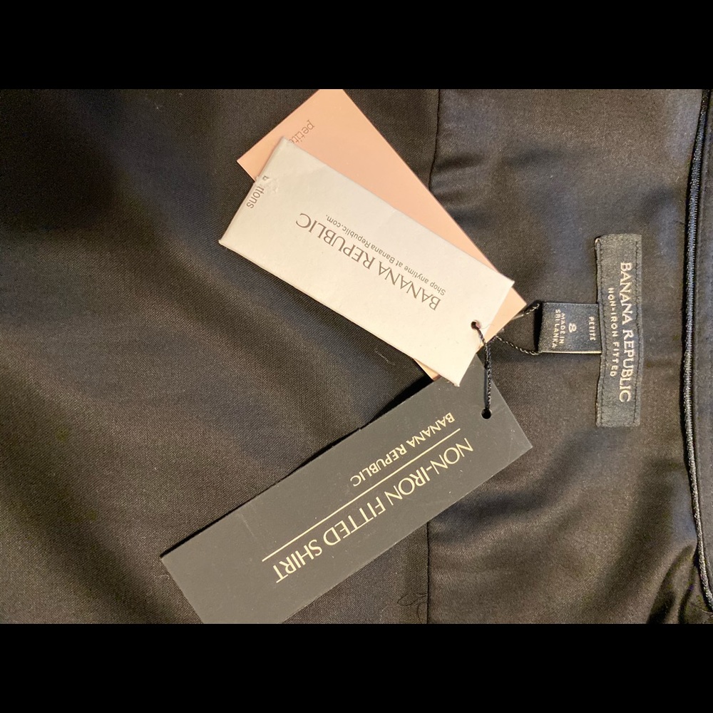 Black non-iron fitted blouse.